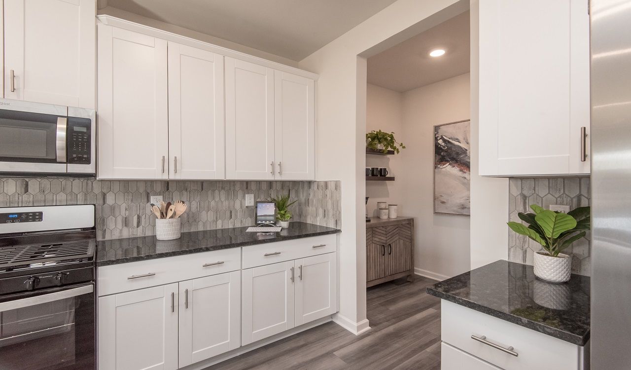 A coffee bar is a nice addition across from the large kitchen pantry.