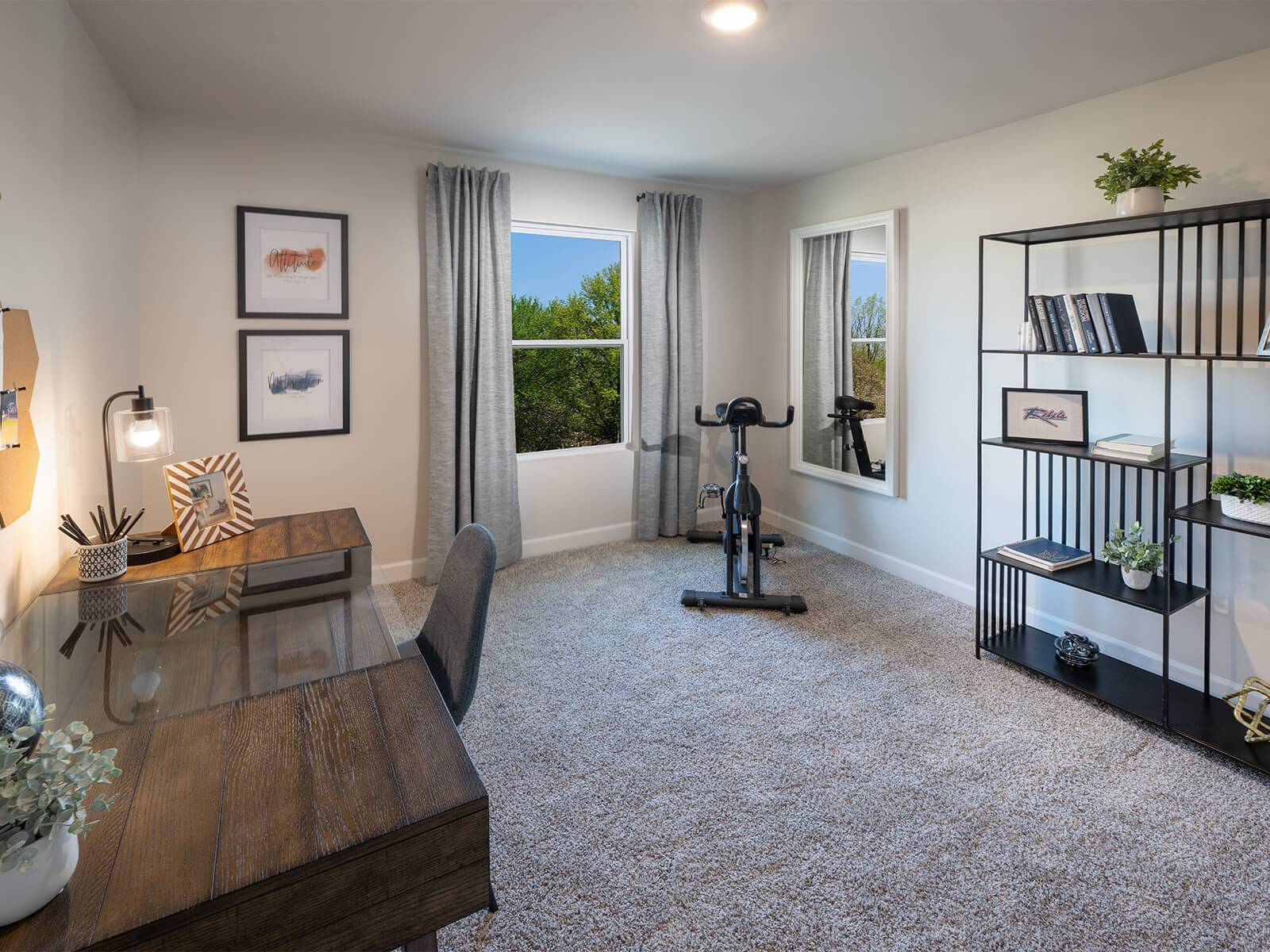 Secondary bedrooms make perfect at-home offices or workout spaces.