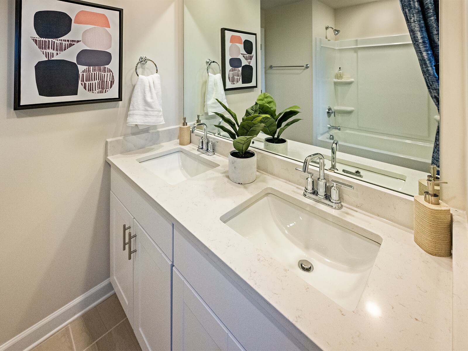 The secondary bath offers a space for guests to get ready.
