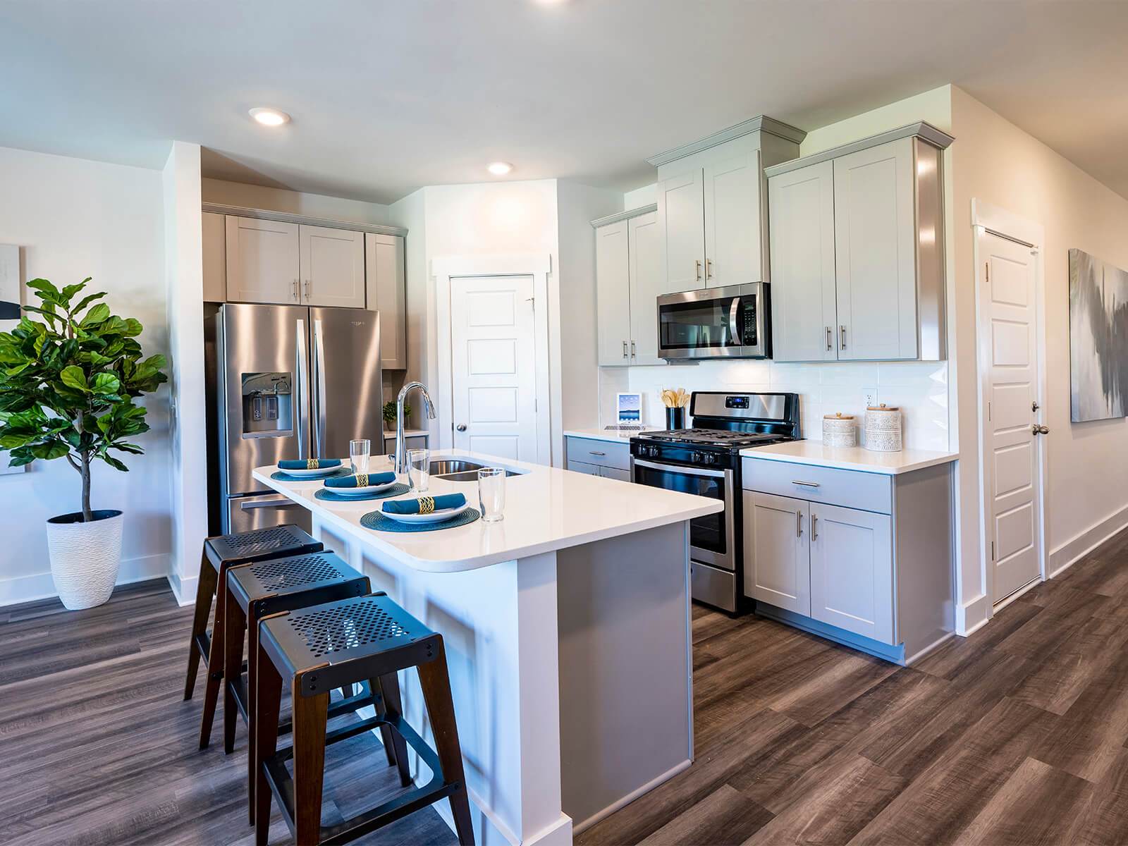 Prep dinner in the kitchen for guests. Photography from Townes at Garrison Grove.