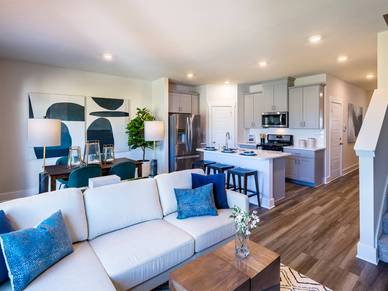 The open-concept floorplan allows for easy entertaining. Photography from Townes at Garrison Grove.