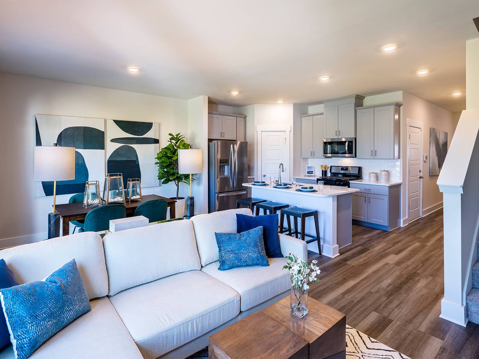 The open-concept floorplan allows for easy entertaining. Photography from Townes at Garrison Grove.