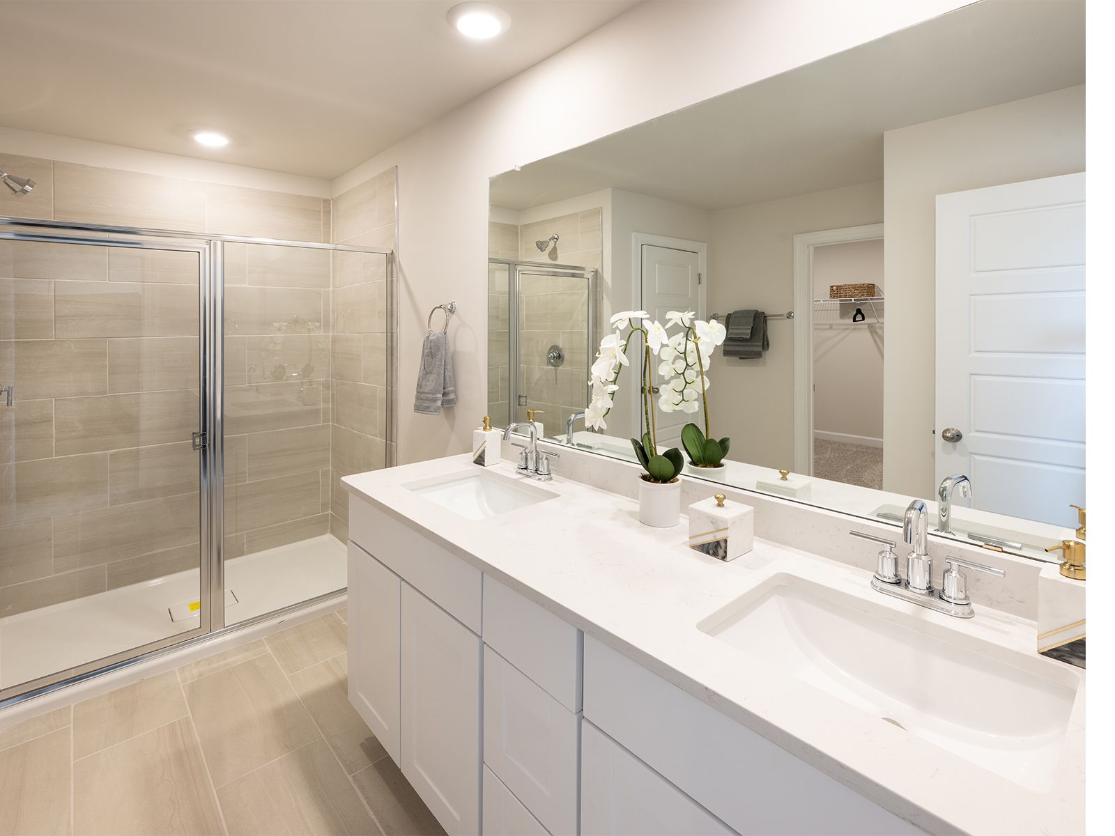 Your primary suite features a walk-in closet and a luxurious bath.