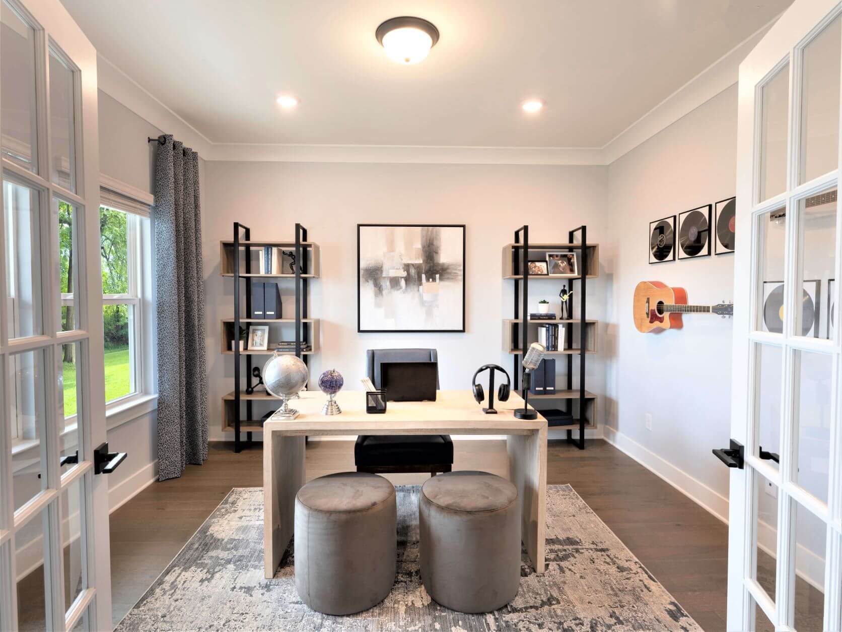 Flex-space off of the foyer can function as a home office.