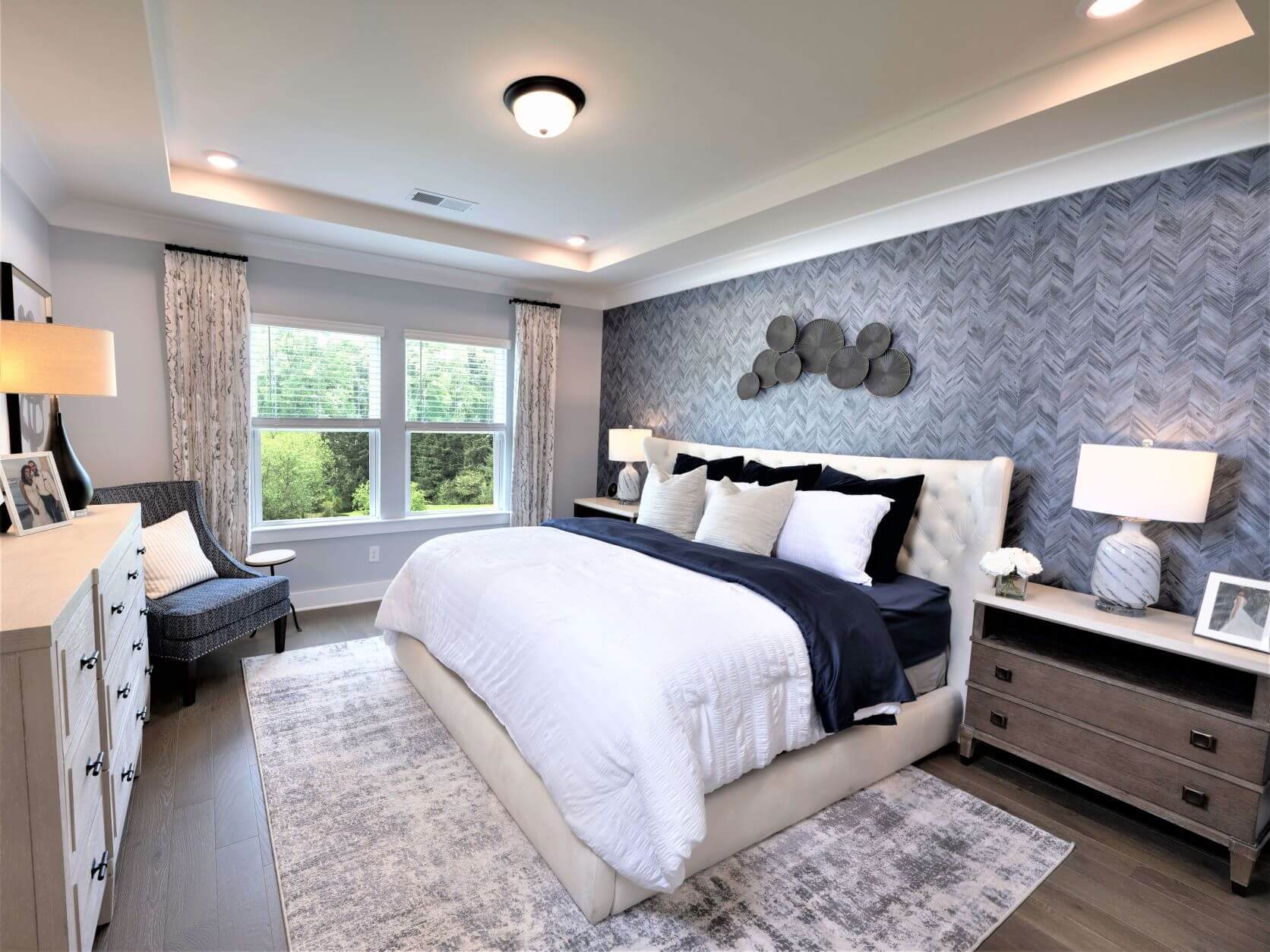 The primary suite offers a private retreat, featuring a luxurious bathroom and walk-in closet.