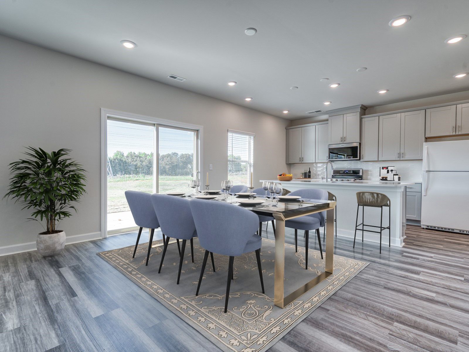A large kitchen island anchors the spacious kitchen and great room.