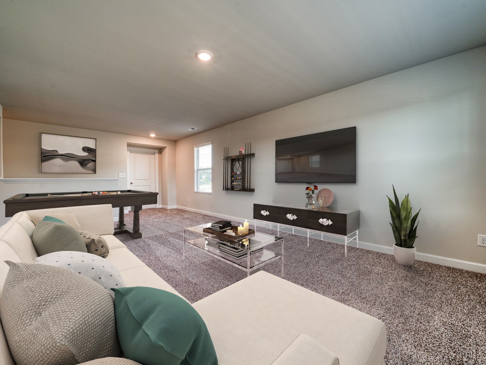 A spacious loft upstairs makes a great movie or game room.