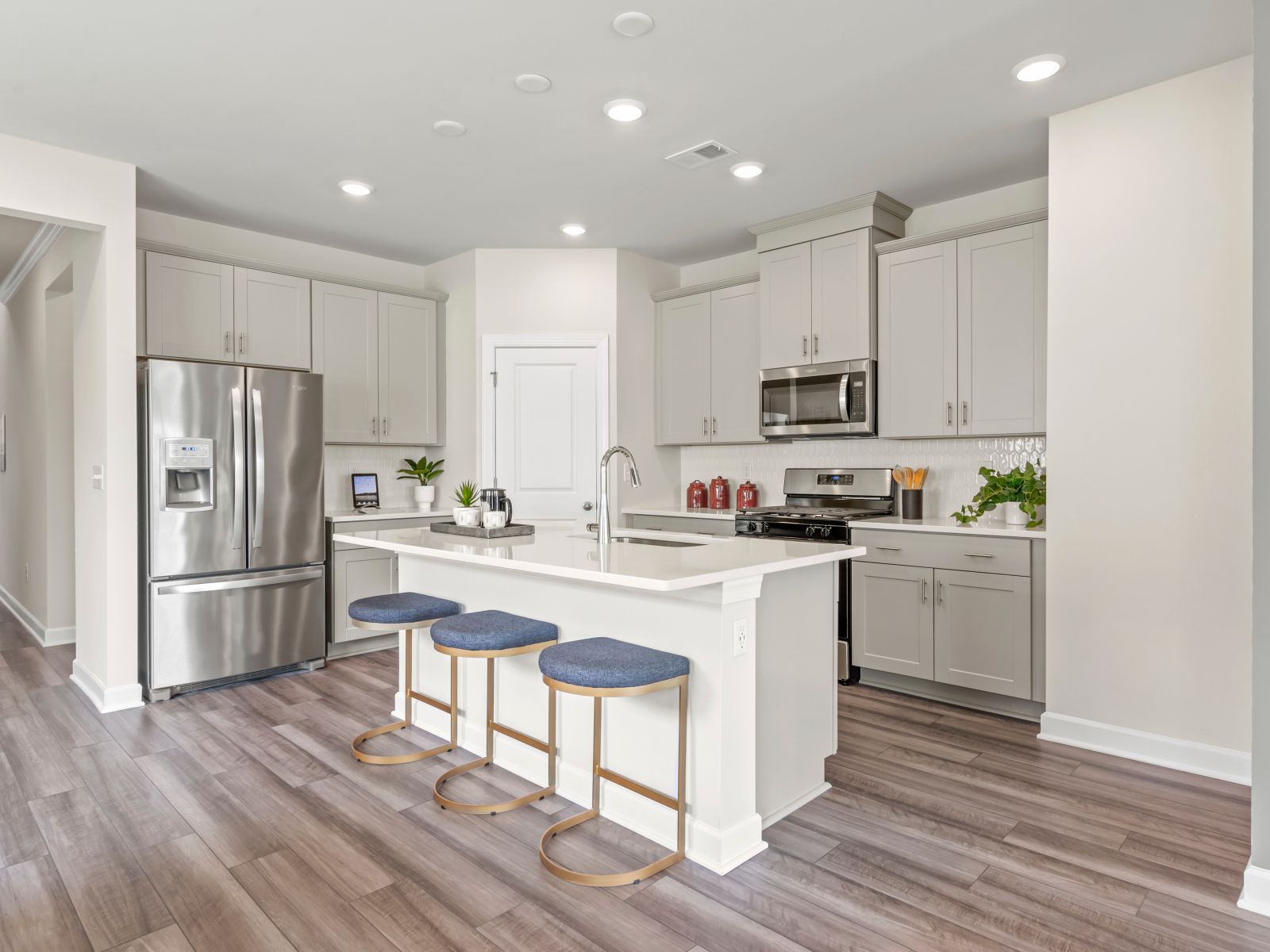 The well-appointed kitchen features a large island to make meal prep a breeze.