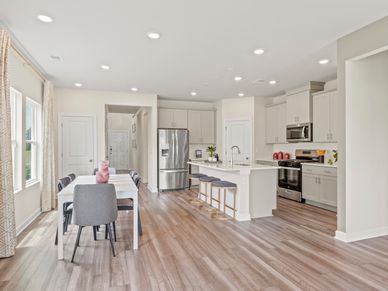 The stunning open-concept floorplan allows for easy flow between the kitchen and dining areas.