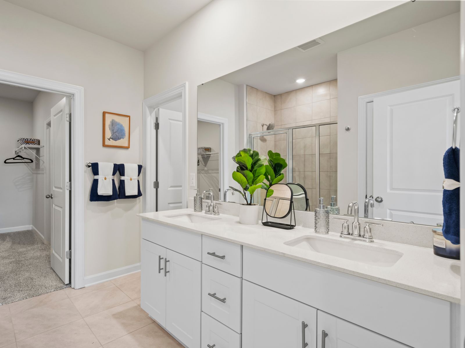 The primary bath offers dual vanity sinks and a walk-in shower (Clear Pond in Myrtle Beach, SC)