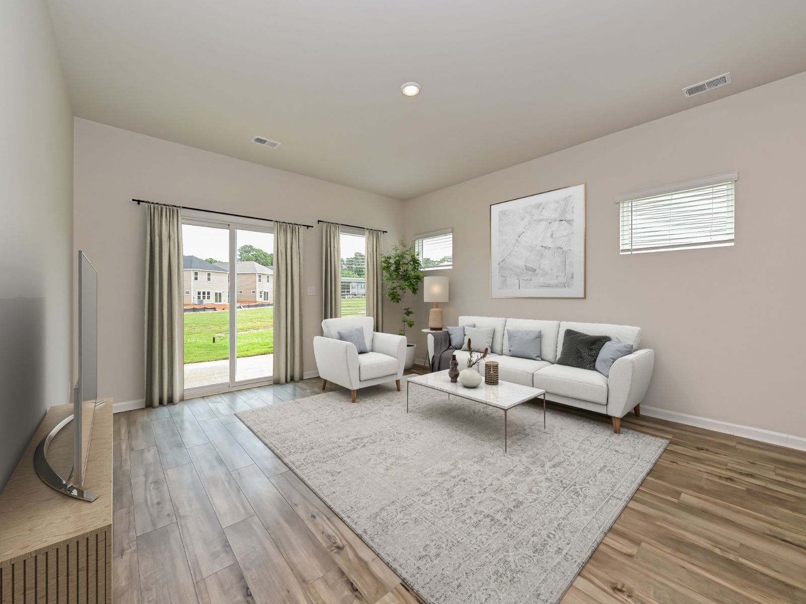 The great room is surrounded with natural light.