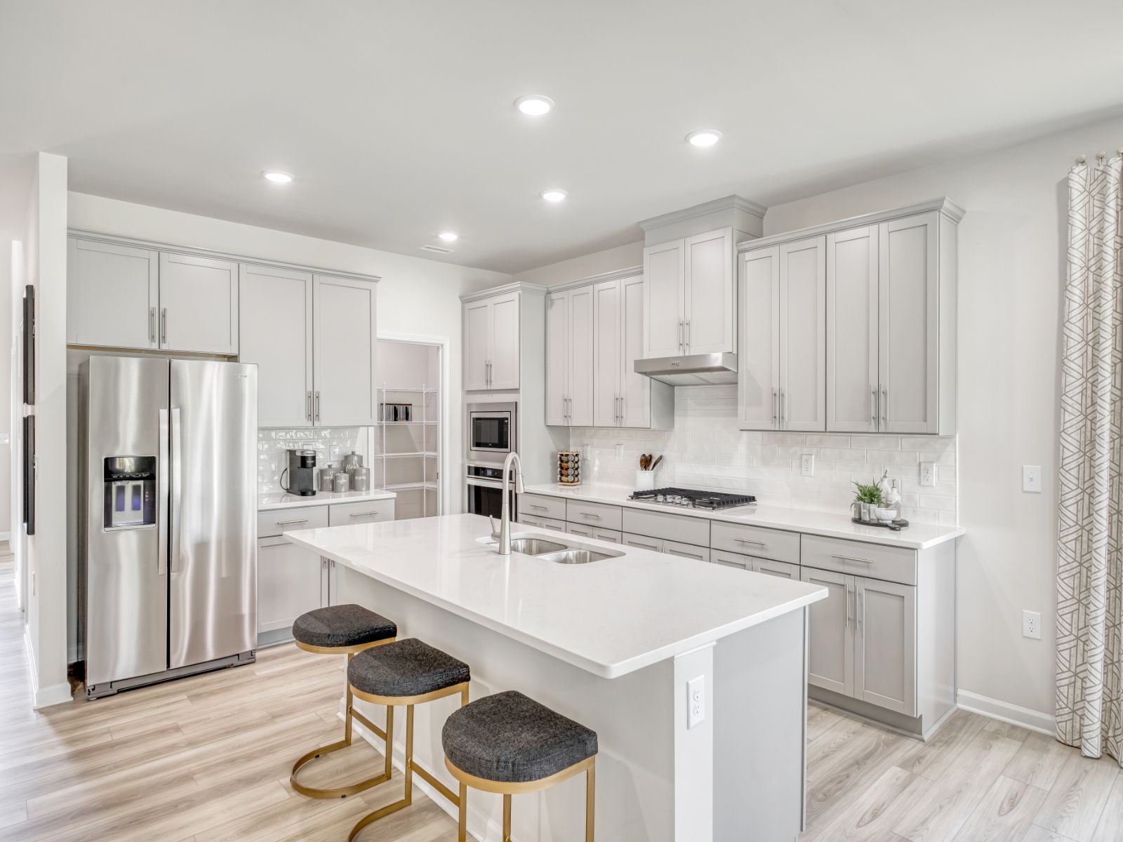Kitchen in the Sherwood floorplan at a Meritage Homes community in Garner, NC.
