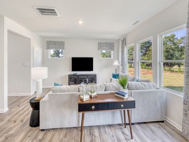 Kick your feet up after a long day and unwind in the open-concept living area.