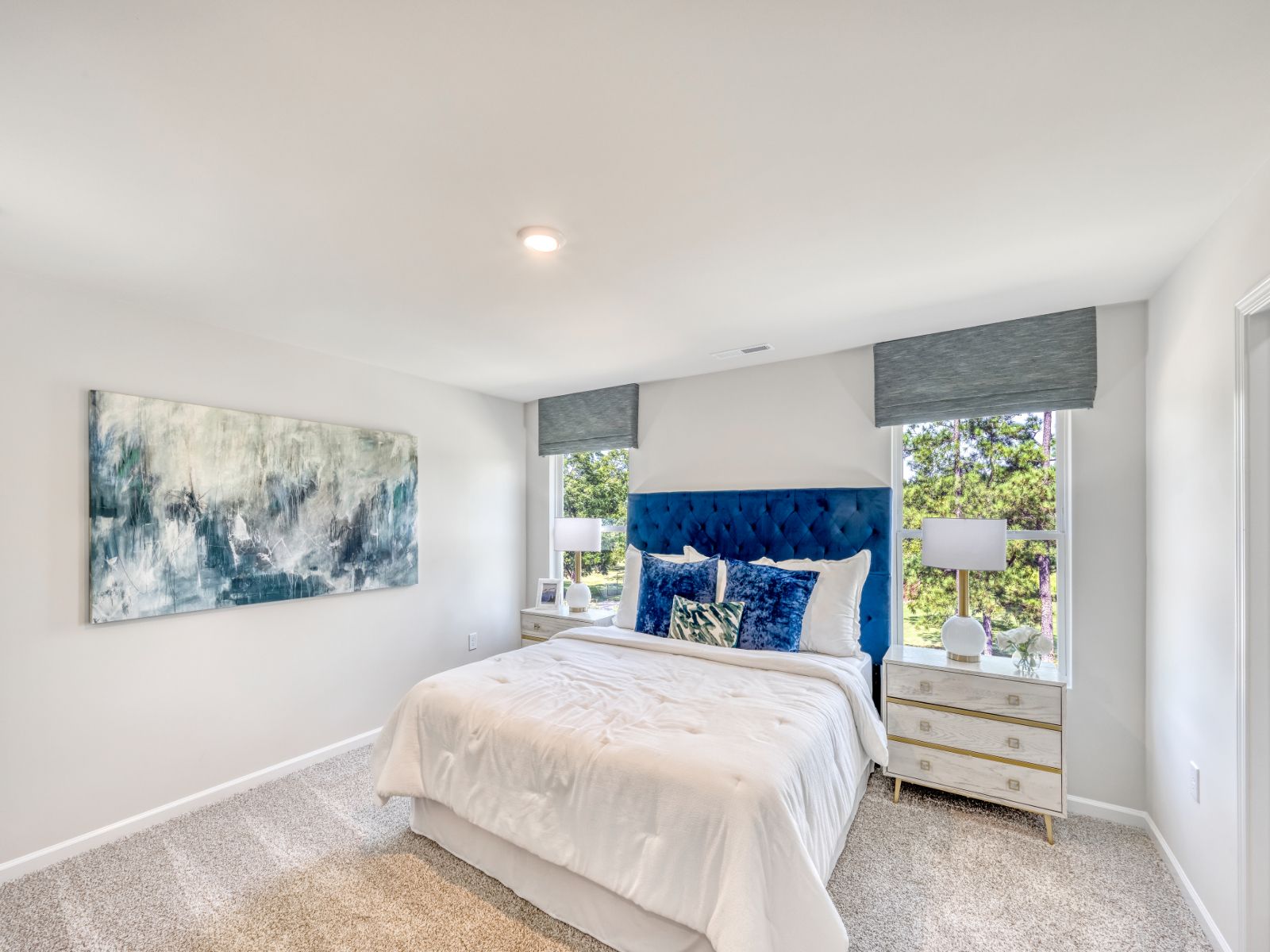 The primary suite's ensuite bath features dual vanities and a large walk-in closet.