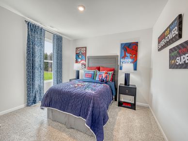 Three secondary bedrooms provide ample space for the whole family.