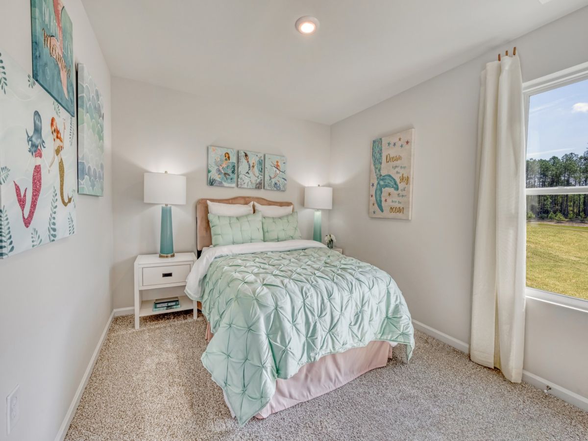 Three secondary bedrooms provide ample space for the whole family.