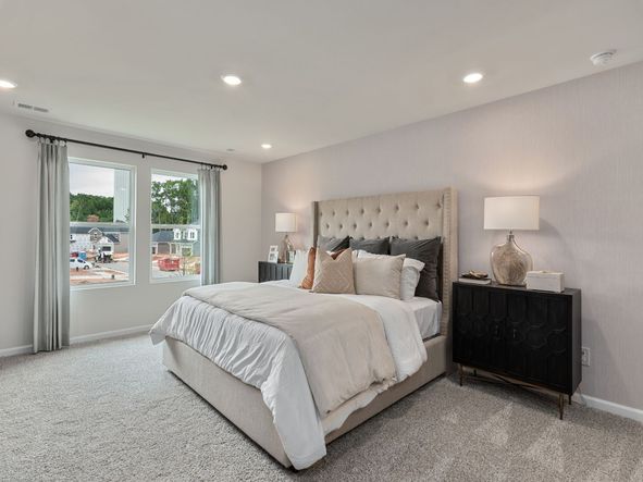 Relax and unwind in the secluded primary bedroom.