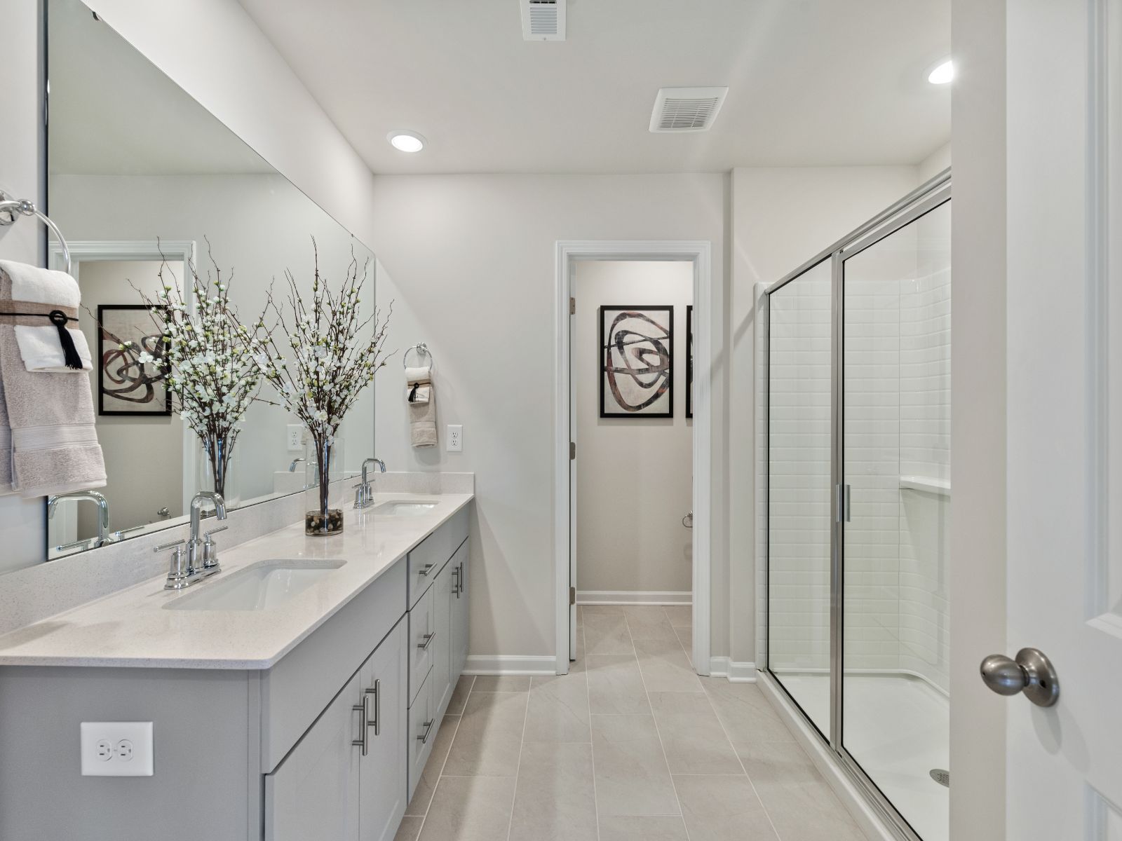 The primary bathroom connects to your primary suite with dual sinks and a walk-in closet.