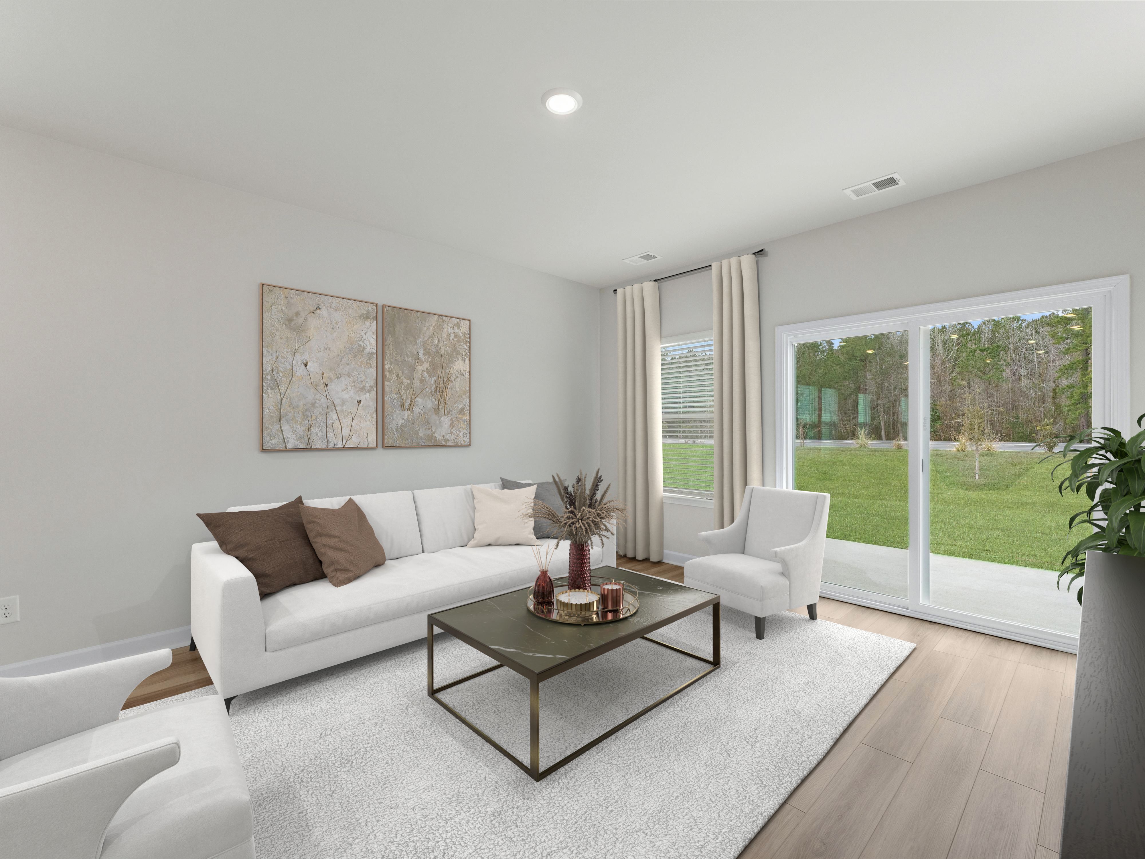 Cozy up with your favorite book in the living room surrounded by natural light.