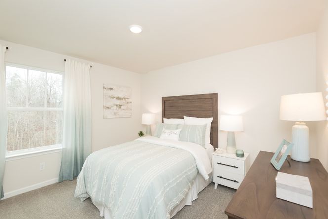 The Dakota floorplan features three secondary bedrooms.