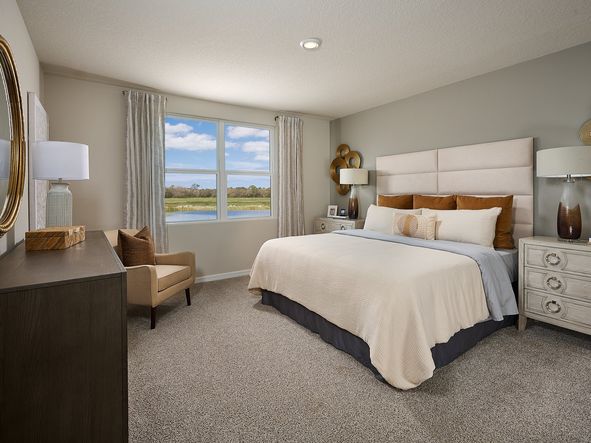 The primary bedroom of the Foxglove modeled at Magnolia Bay.