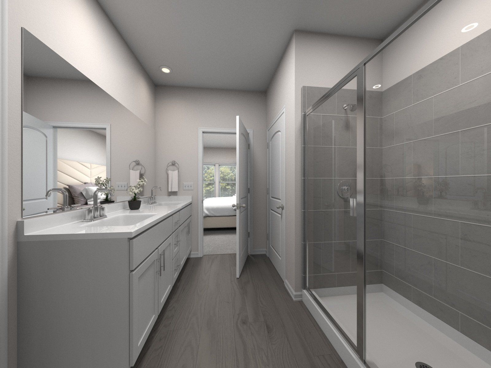 The primary bathroom offers dual sinks and walk-in shower.