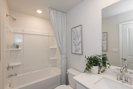 The secondary bathroom is a private retreat for guests.