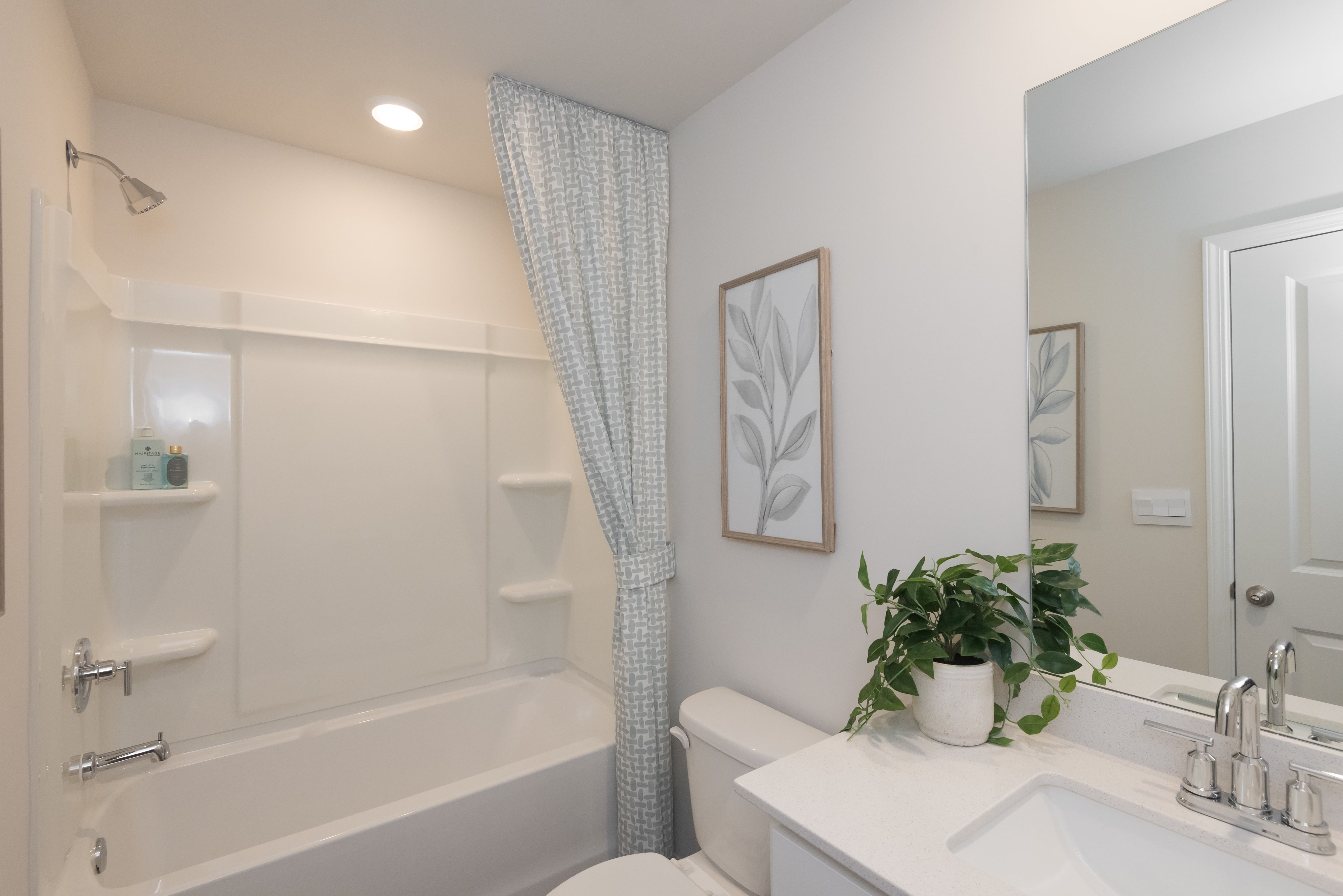 The secondary bathroom is a private retreat for guests.