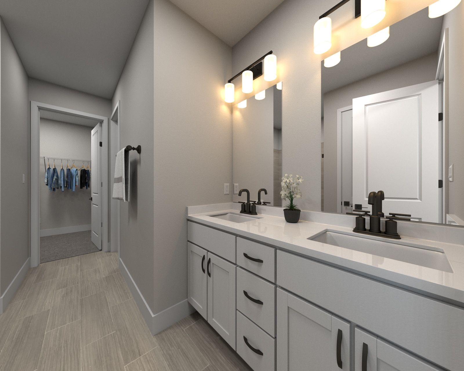 The primary bathroom offers dual vanity sinks and a walk-in closet.