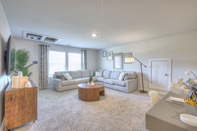 The upstairs loft gives the kids a place to study.