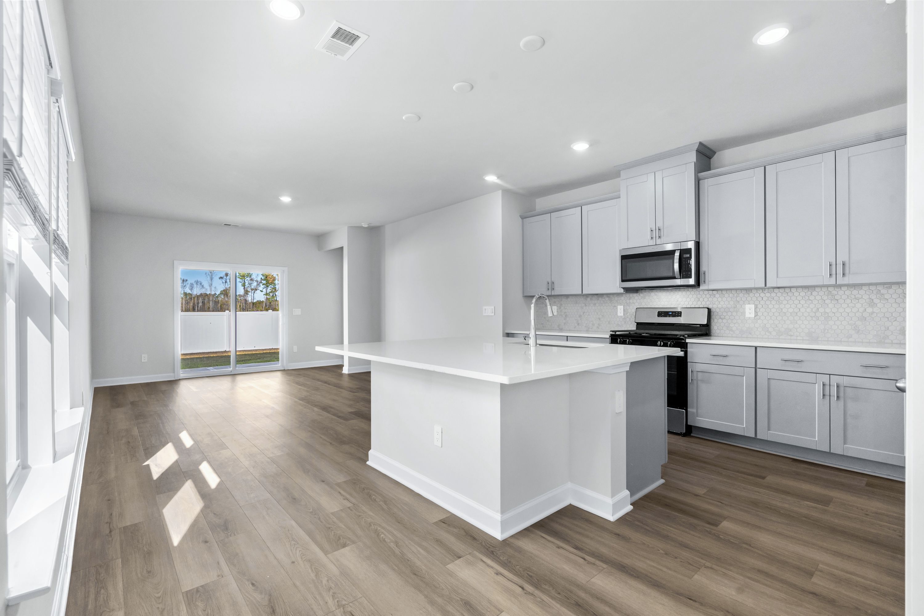 The kitchen overlooks the dining area and great room.