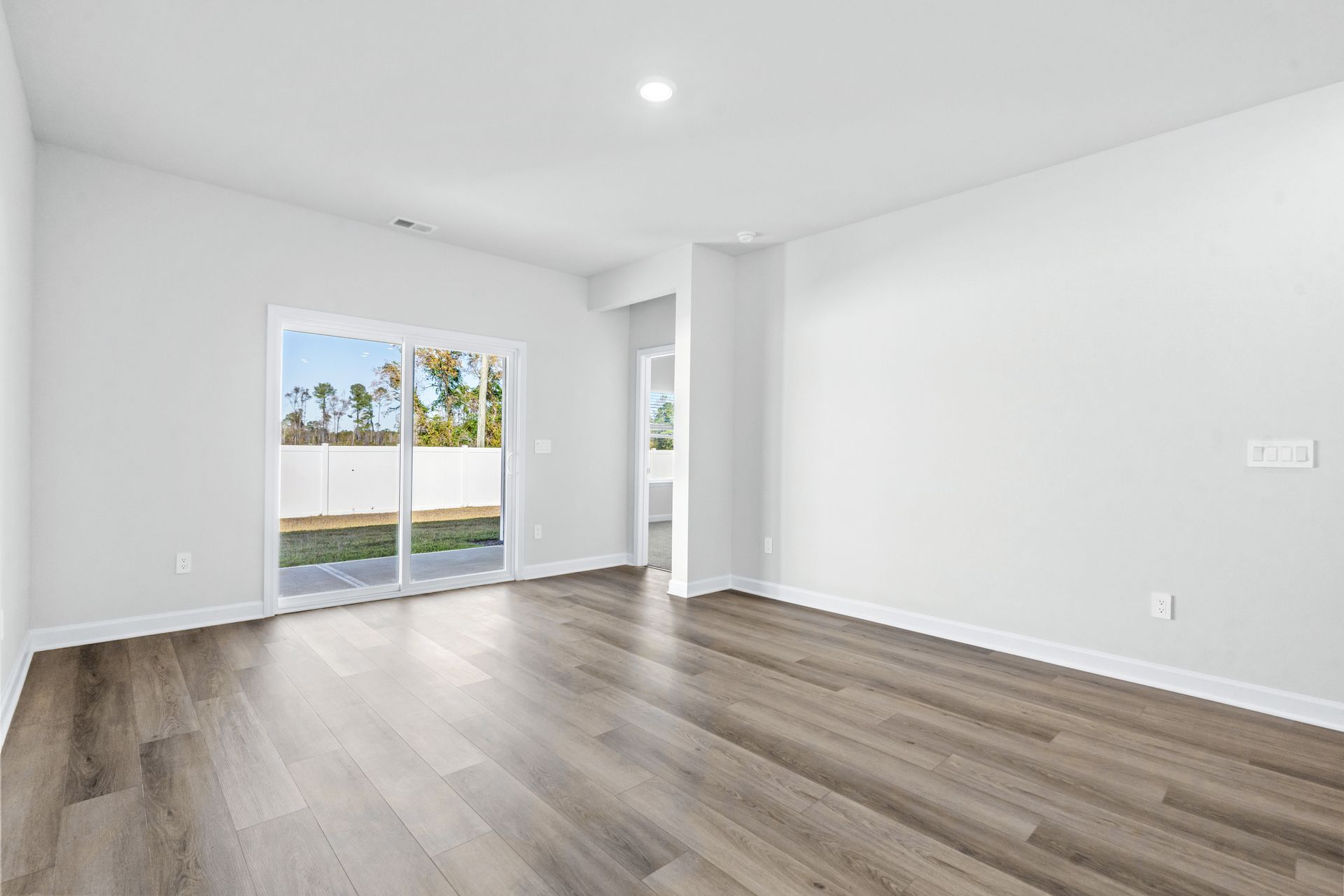 The open-concept living space is accentuated with plenty of natural light.