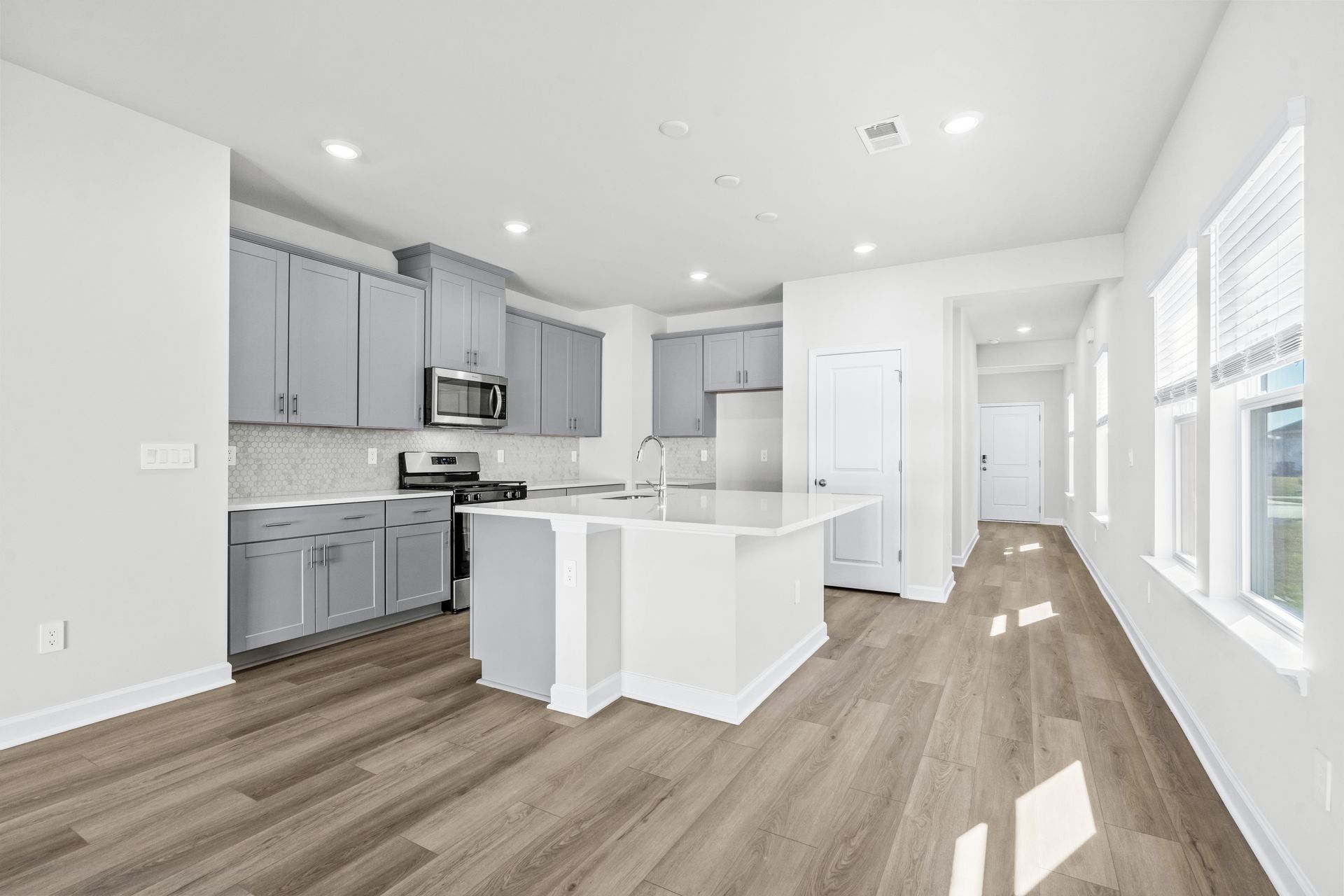 Enjoy preparing meals in this open kitchen with large work island.
