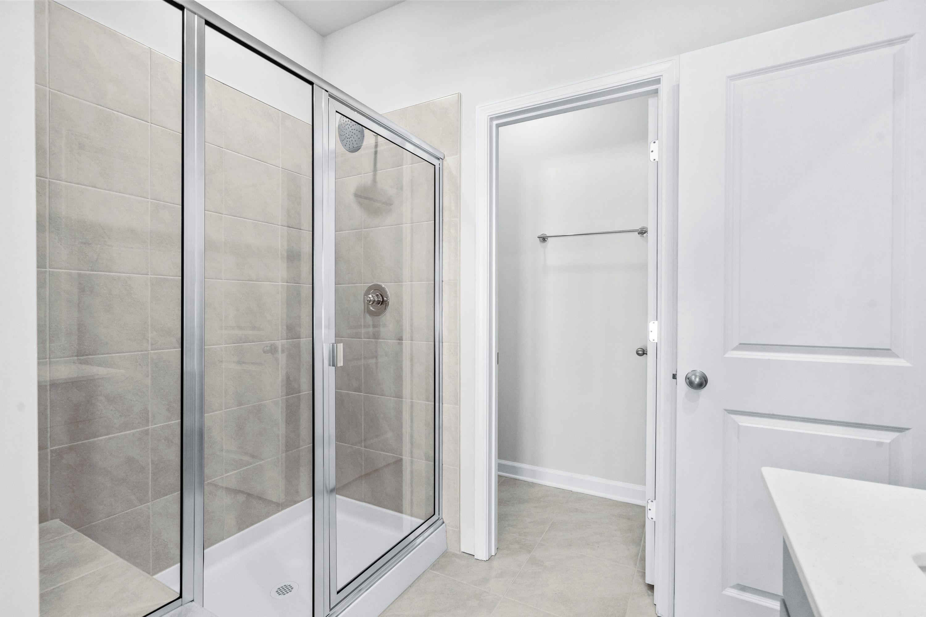 The primary ensuite boasts duel sinks, tile shower and large walk-in closet.