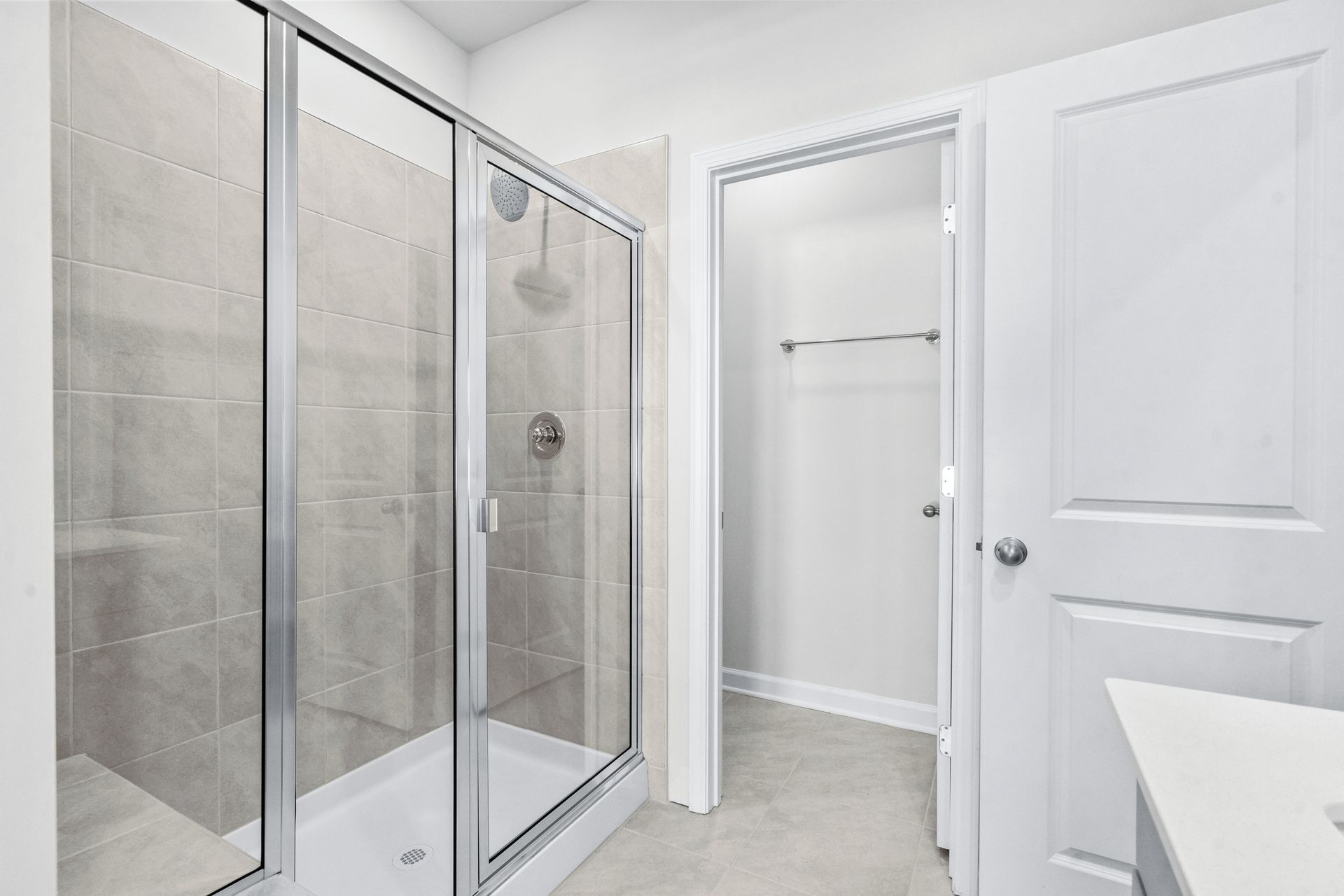 The primary ensuite boasts duel sinks, tile shower and large walk-in closet.