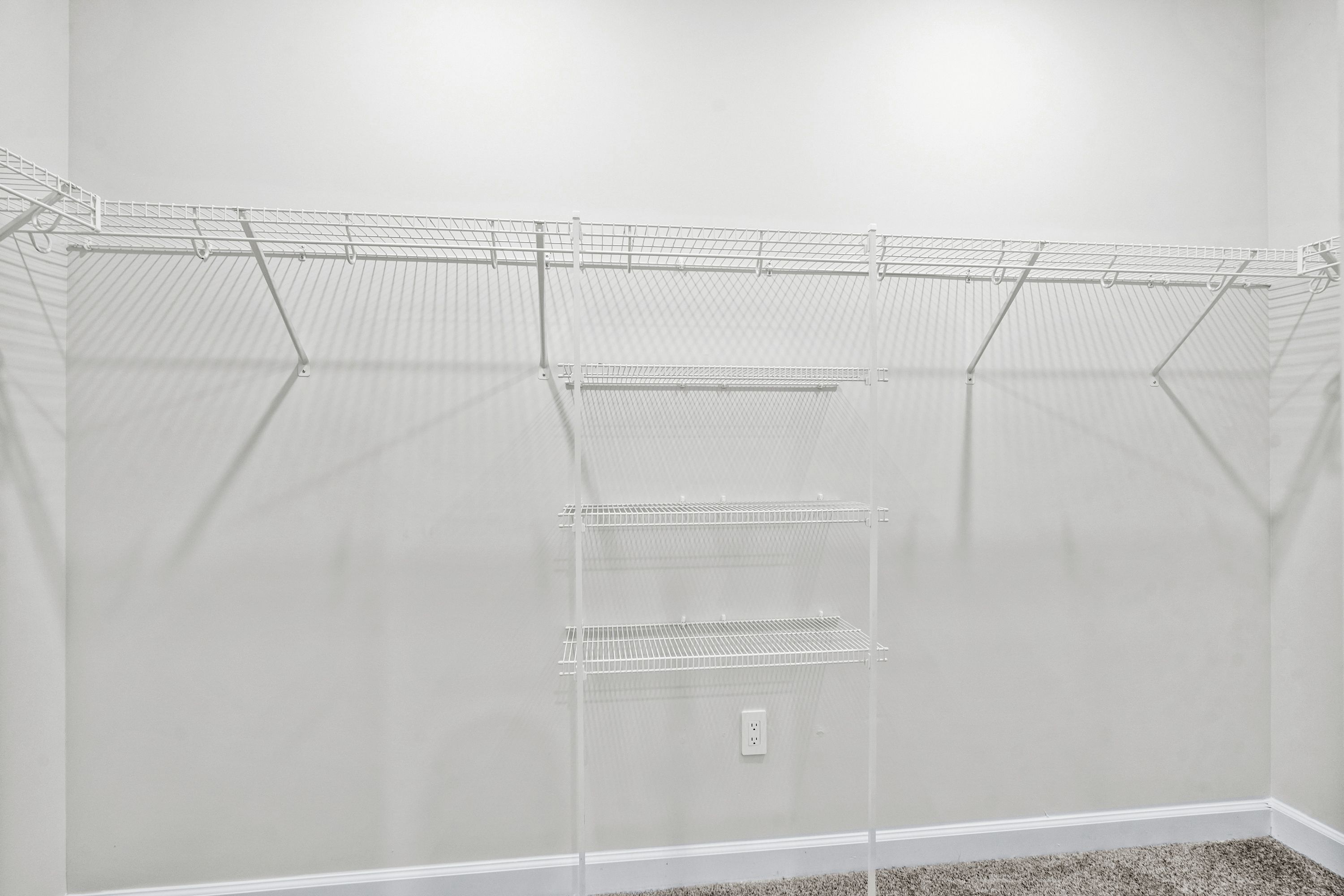 The walk-in closet off of the primary bathroom offers an abundance of space.