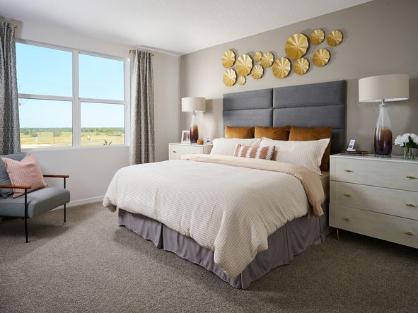Primary bedroom in the Hibiscus model at Benton Hills.