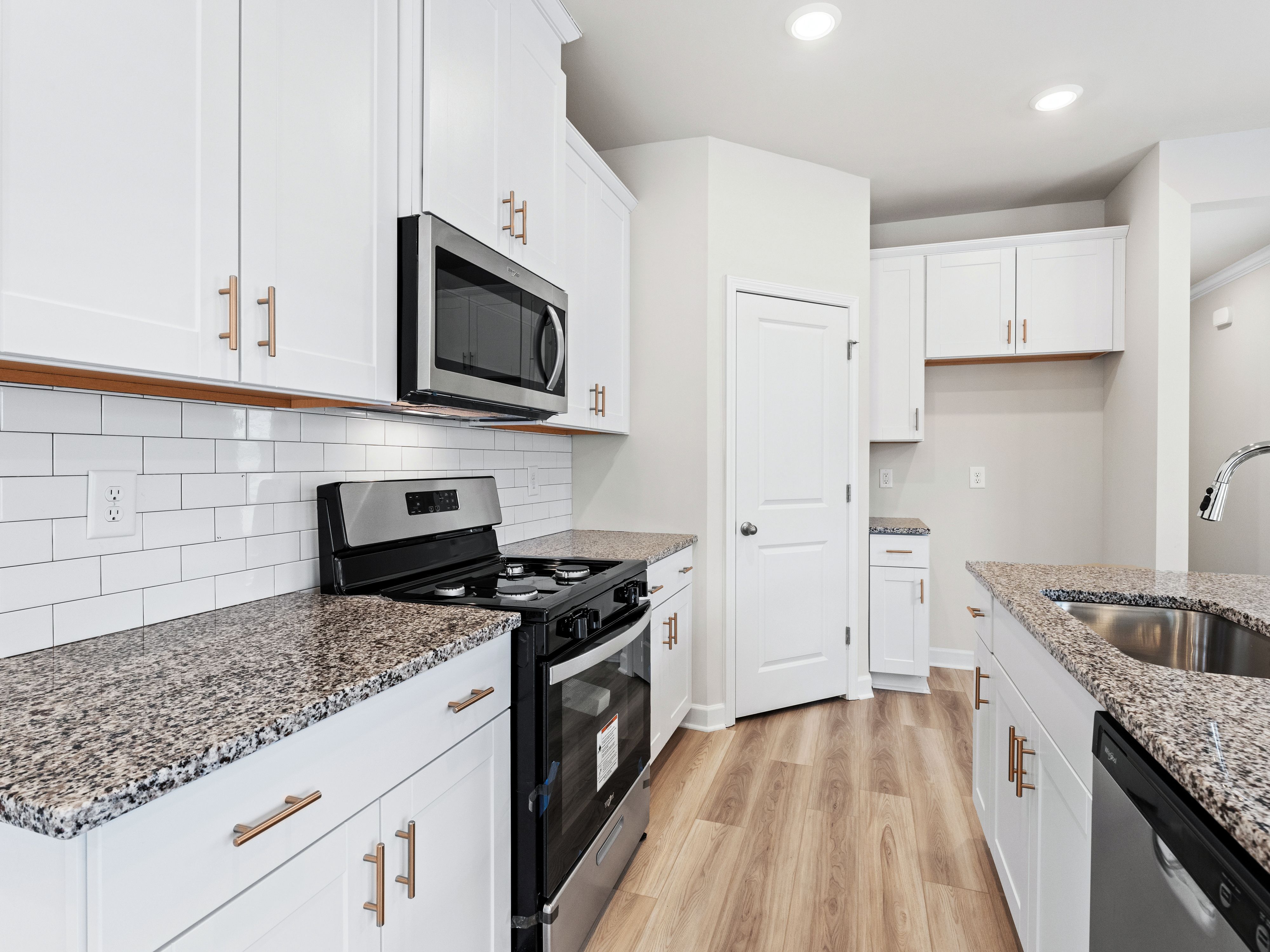 The spacious kitchen island and food storage cabinets make it easy to cook your favorite meal.