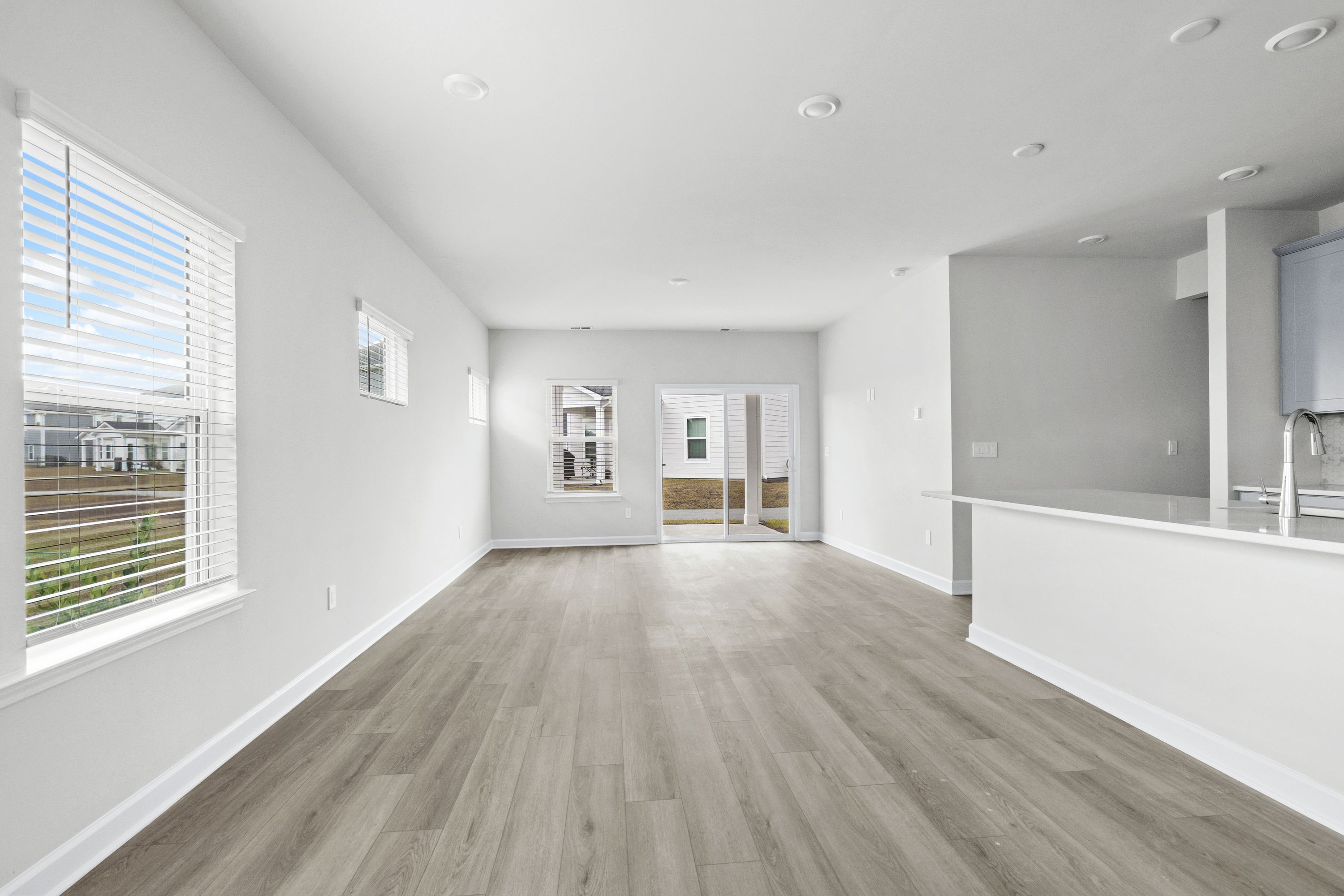 The open-concept living space is accentuated with plenty of natural light.