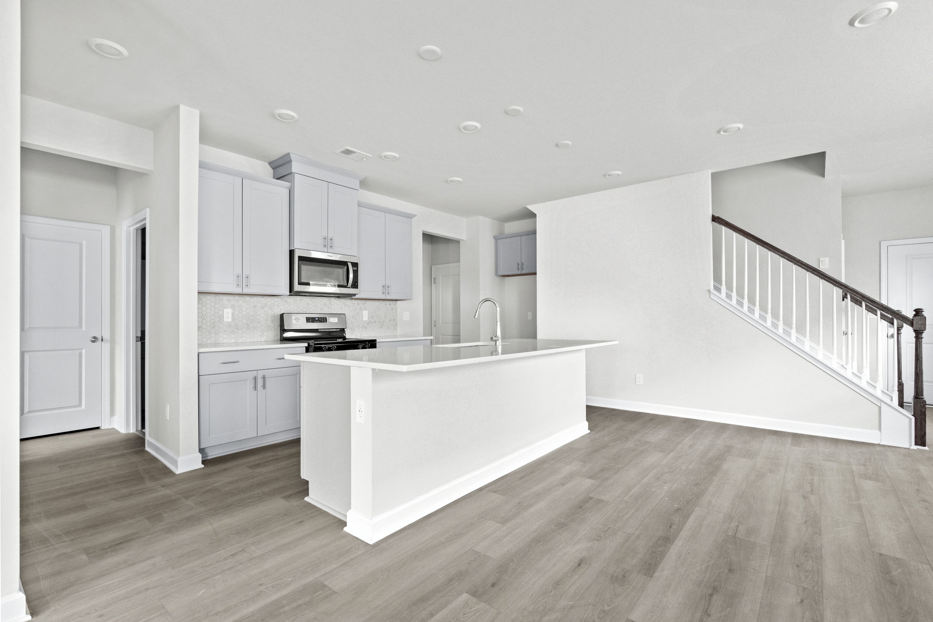 The stunning open-concept floorplan allows for easy flow between the kitchen and dining areas.