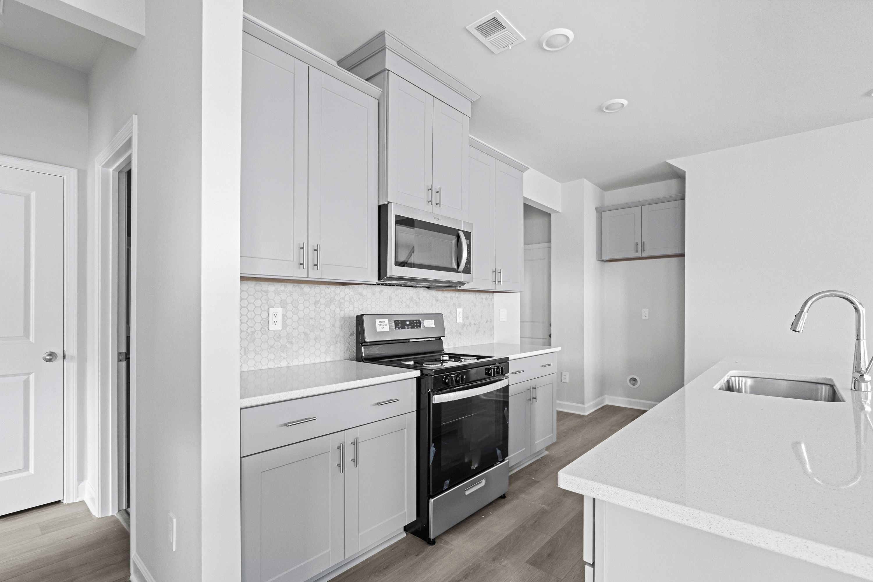 The well-appointed kitchen features plenty of counter space to make meal prep a breeze.