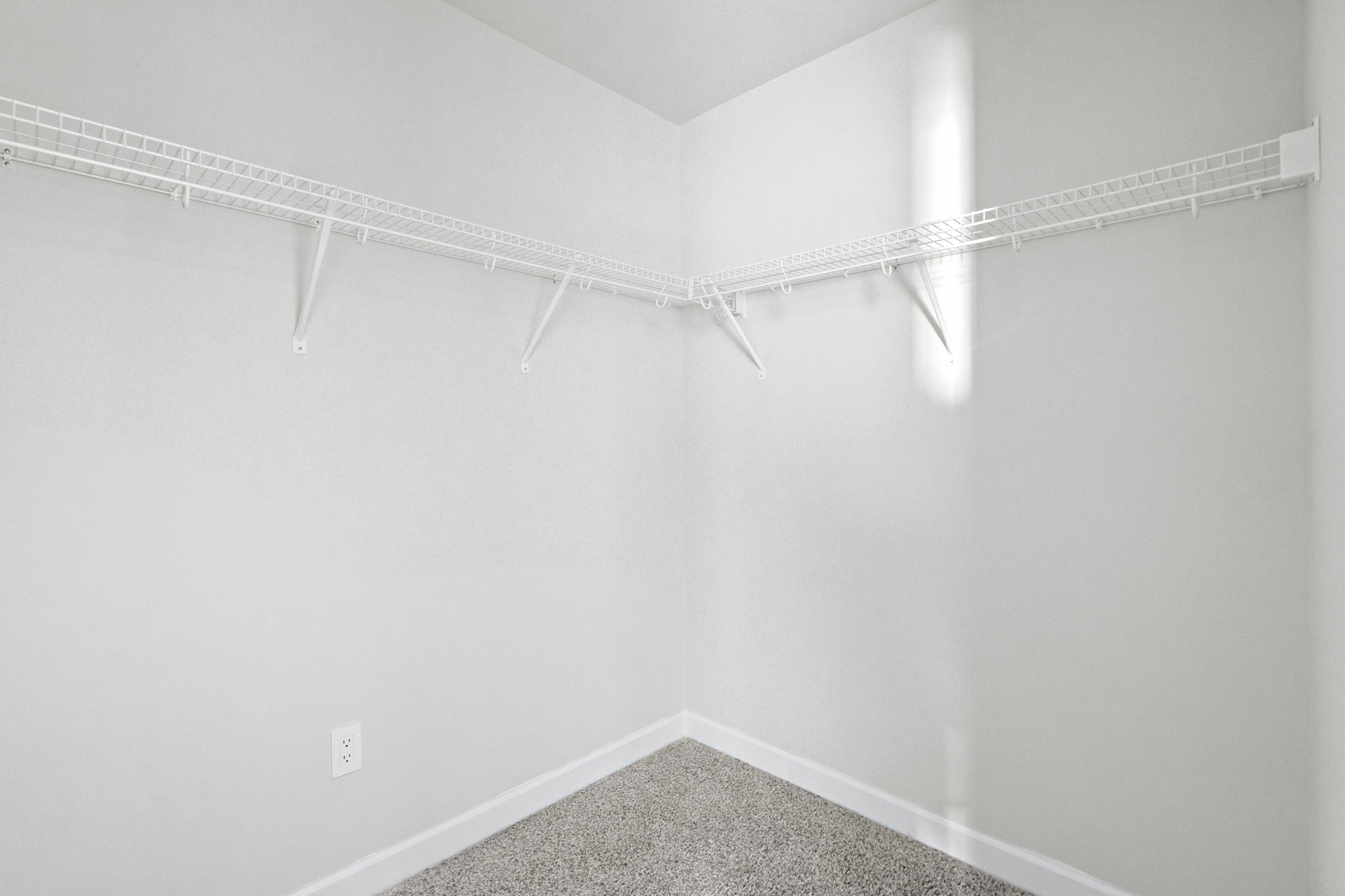 The walk-in closet off of the primary bathroom offers an abundance of space.