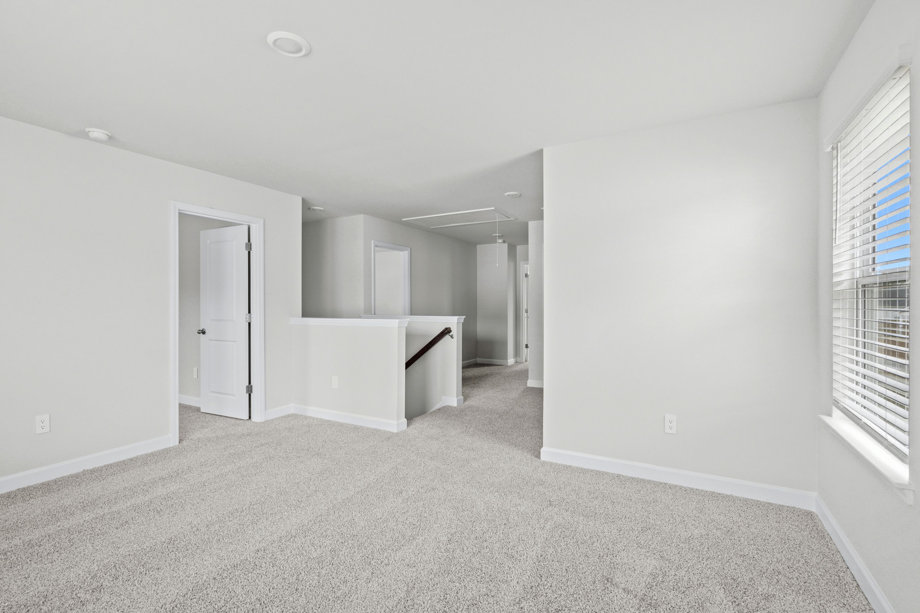 The stairs lead to a second floor with flexible work area.