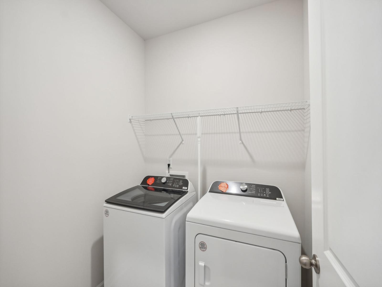 Your laundry room, equipped with shelving to keep your essentials organized.