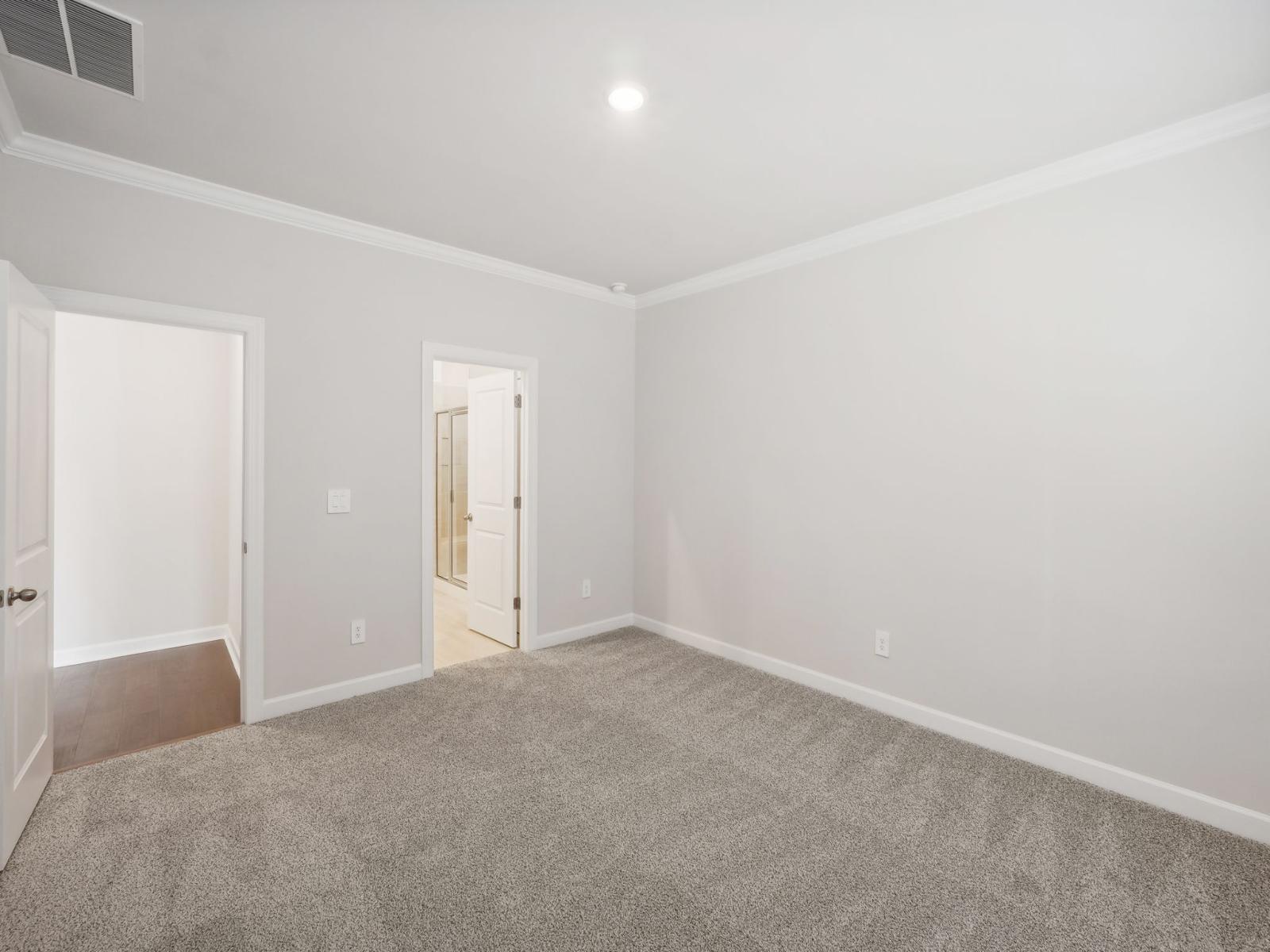 Your primary suite, connecting you to the oversized closet and luxurious bathroom.