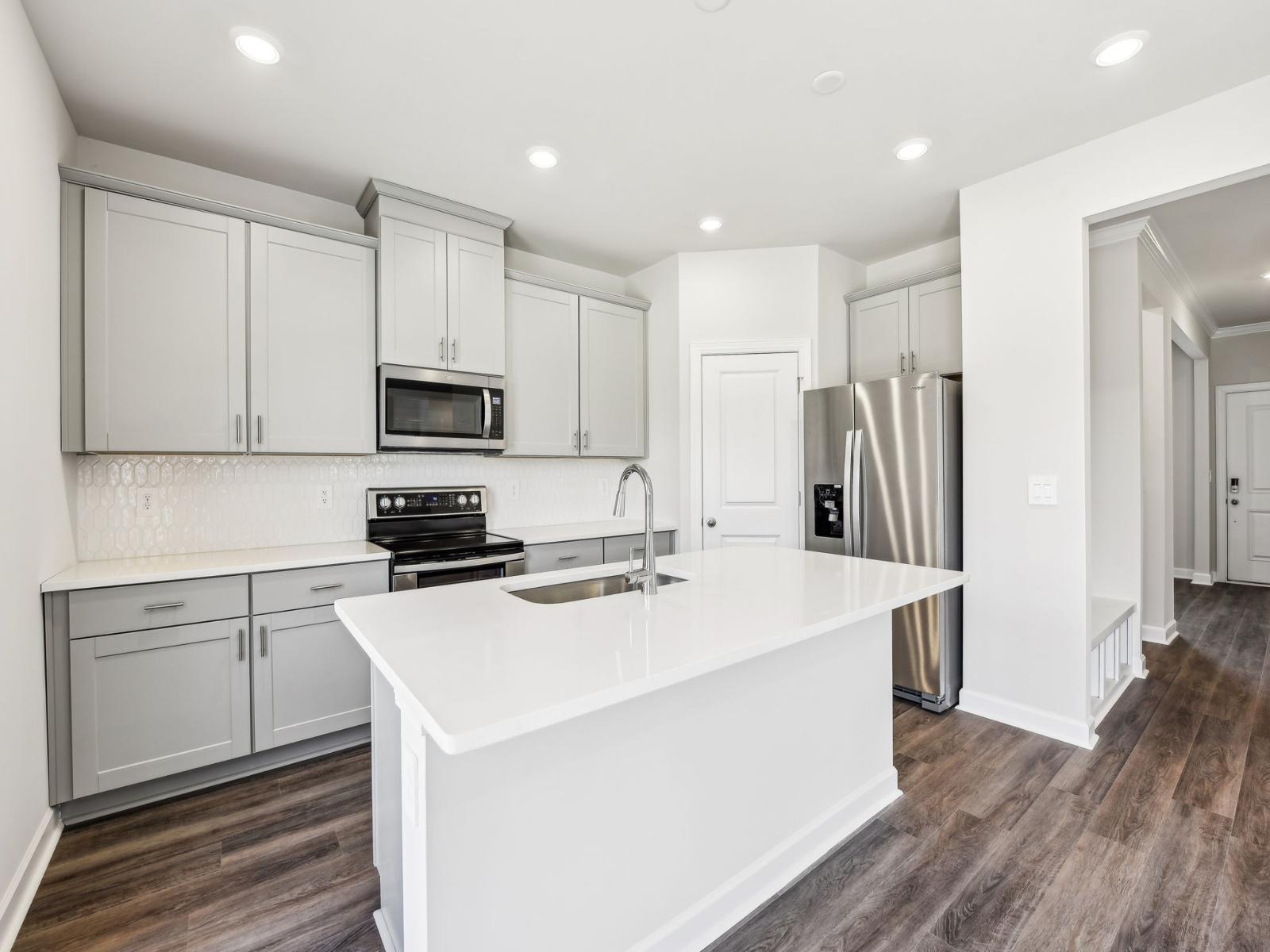 With an oversized island and plenty of cabinets, cooking can be an enjoyable pastime.