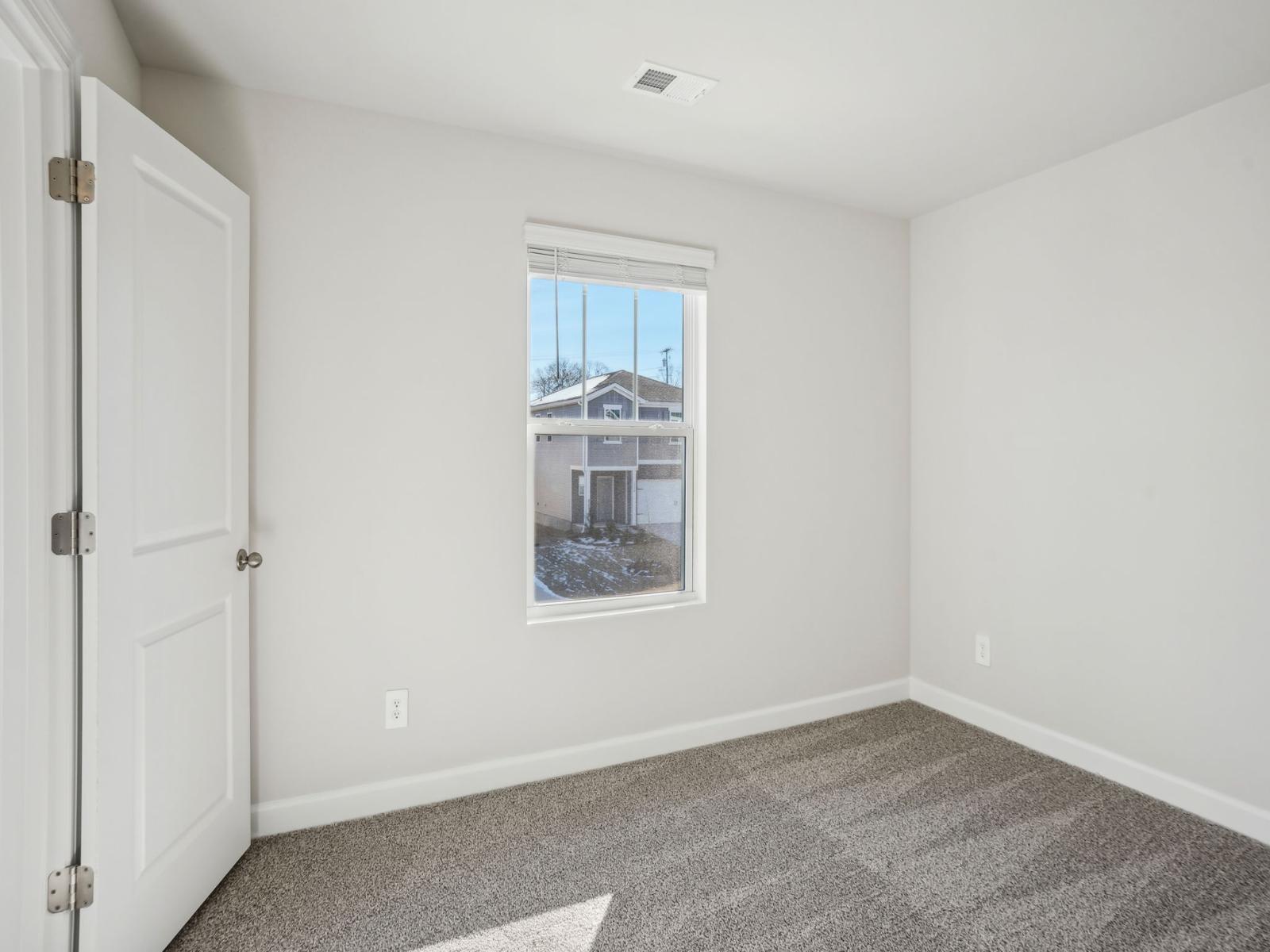 A secondary bedroom customizable for guests or your personal home office.