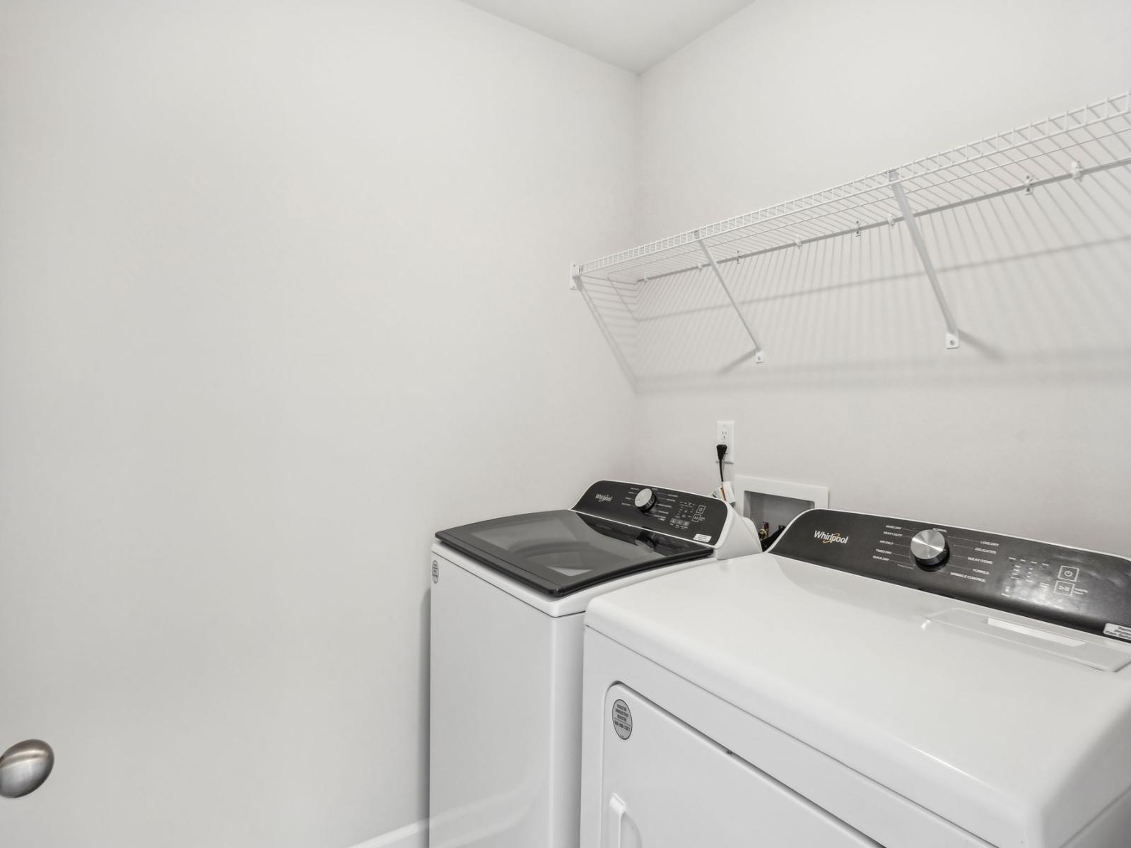The laundry room has all the space you need to organize your cleaning essentials.