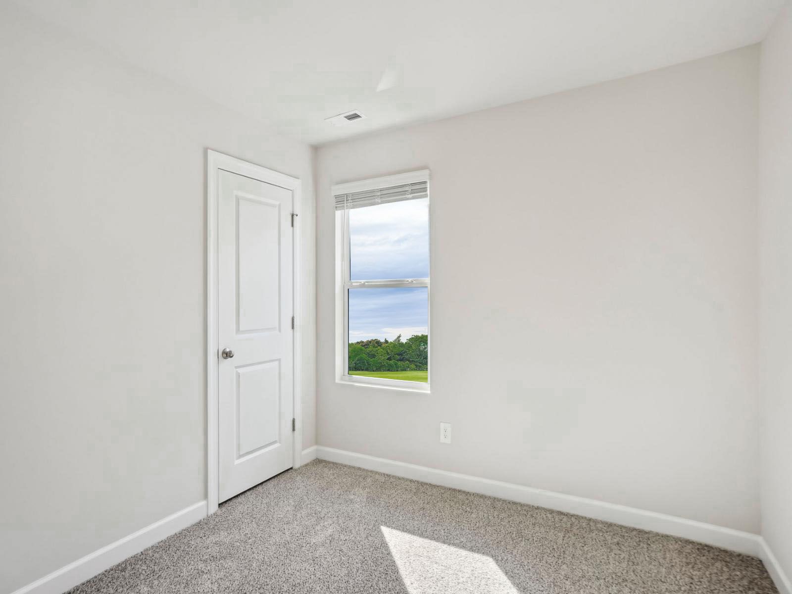 A secondary bedroom for guests or a reading nook.