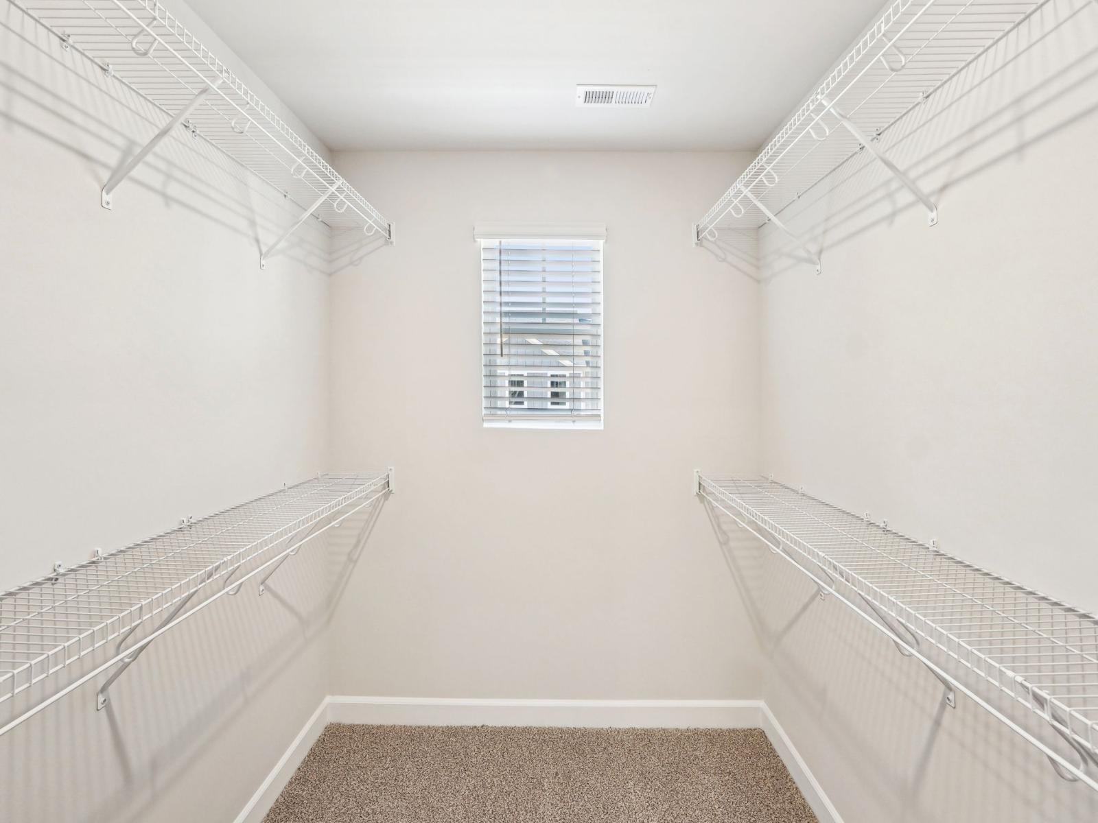Your oversized primary bedroom closet makes organizing clothes and other essentials easier.